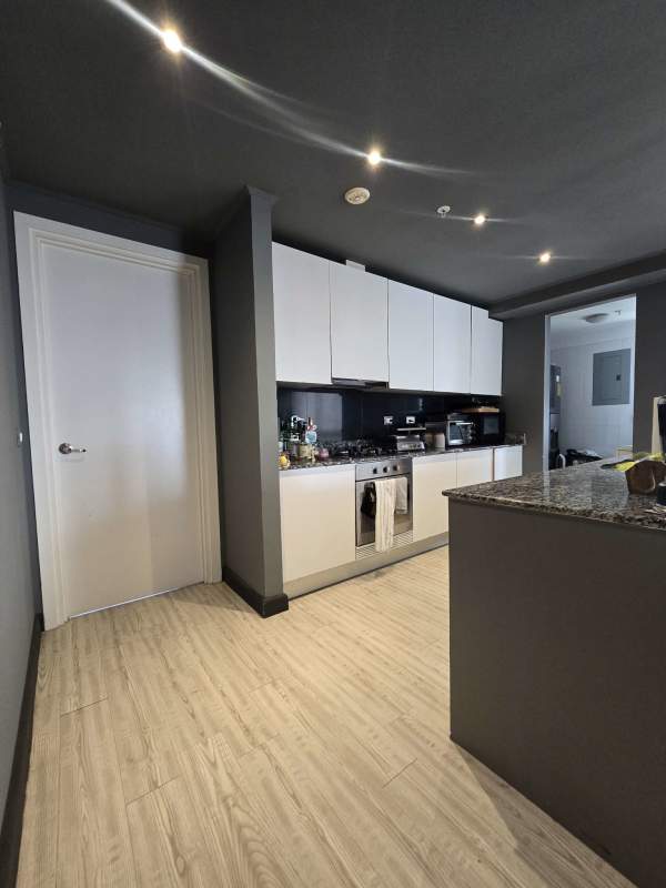 Modern open kitchen granite countertop PH Quartier Atlapa Panama City apartment for sale
