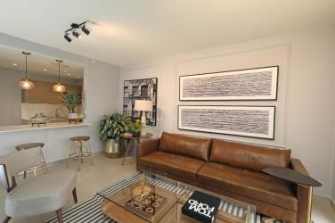 Open kitchen with stainless appliances wood cabinetry PH Madeira Panama