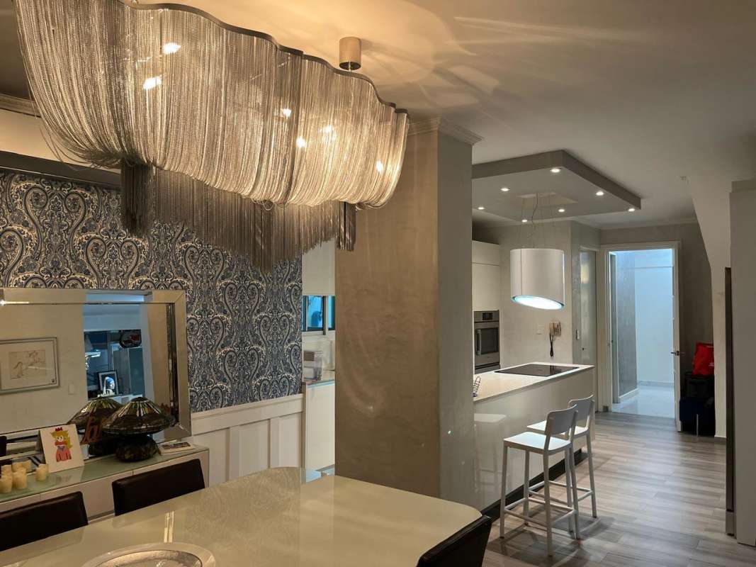 Spacious dining space with designer lighting and modern finishes in Punta Pacifica penthouse