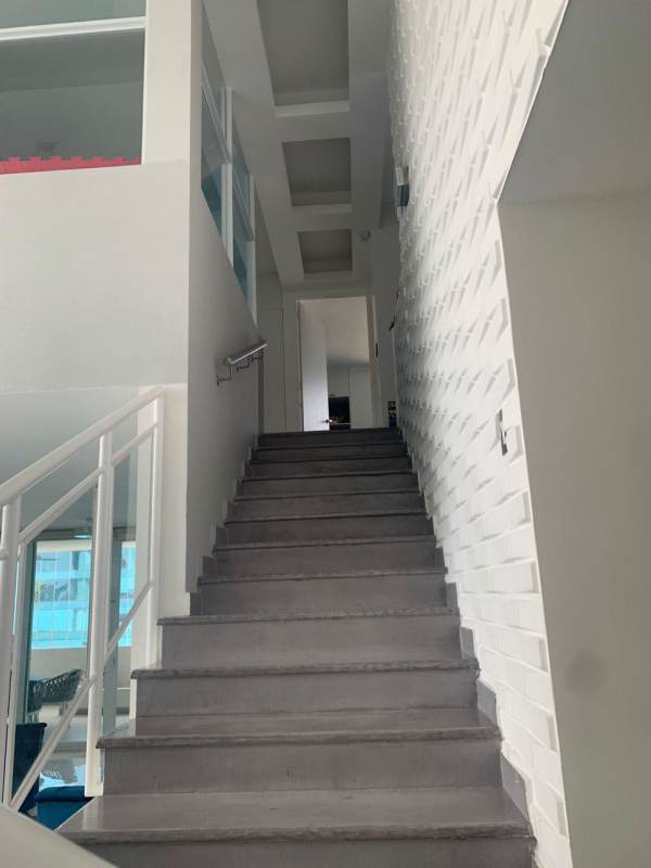 Modern minimalist staircase connecting penthouse floors PH Costa Pacifica
