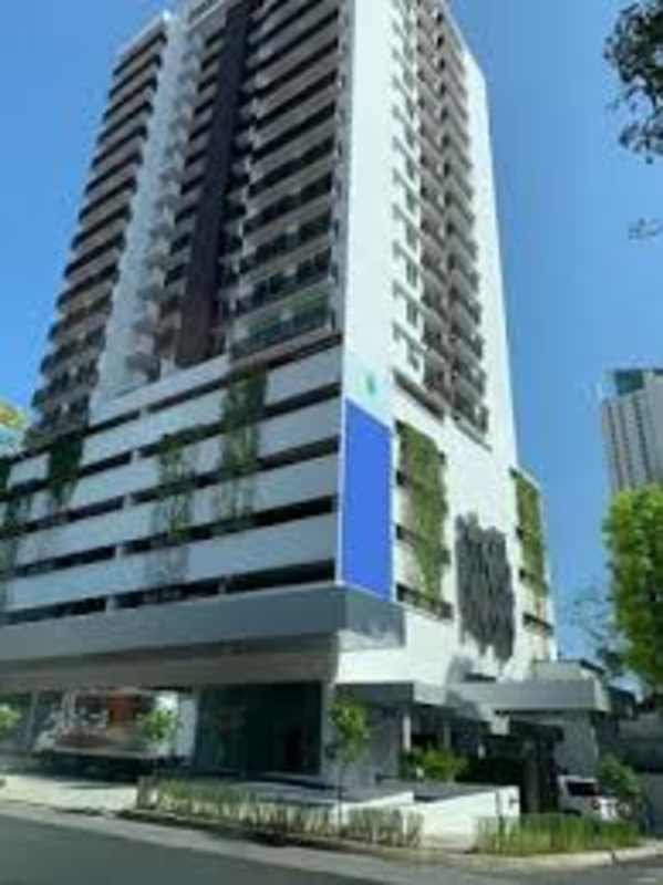 Modern high-rise building exterior with balconies and greenery Bella Vista Panama