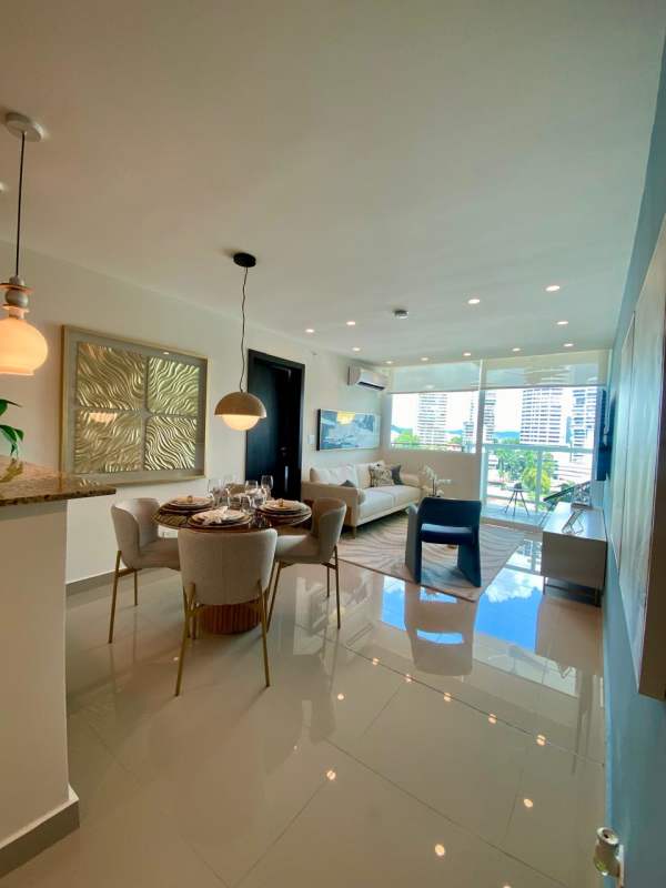 Modern open-plan living dining with large windows and city skyline views in Bella Vista Panama