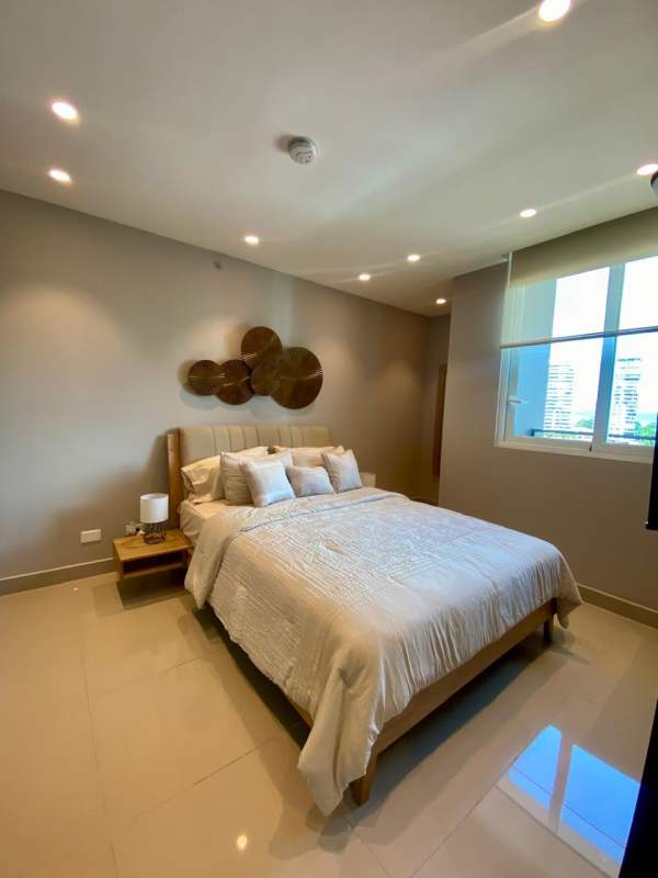 Bedroom with beige decor, large window, and city views PH Bella Vista Heights Bella Vista Panama