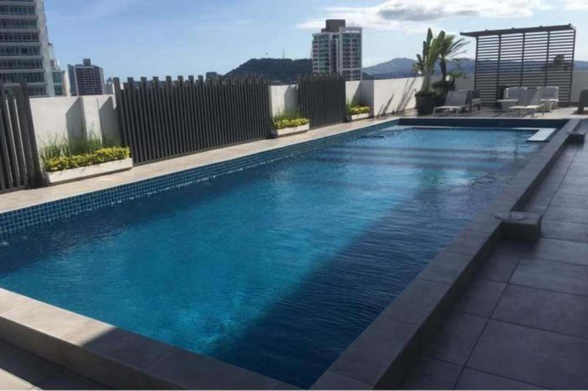 Modern rooftop pool terrace with panoramic skyline and mountain views Bella Vista Panama