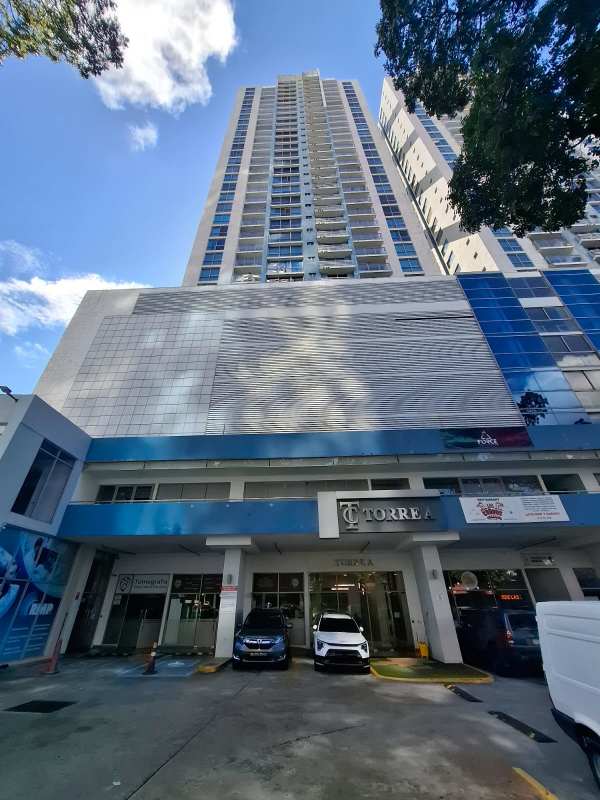 Modern high-rise condominium PH Torre de Castilla on Via España with balconies and shops