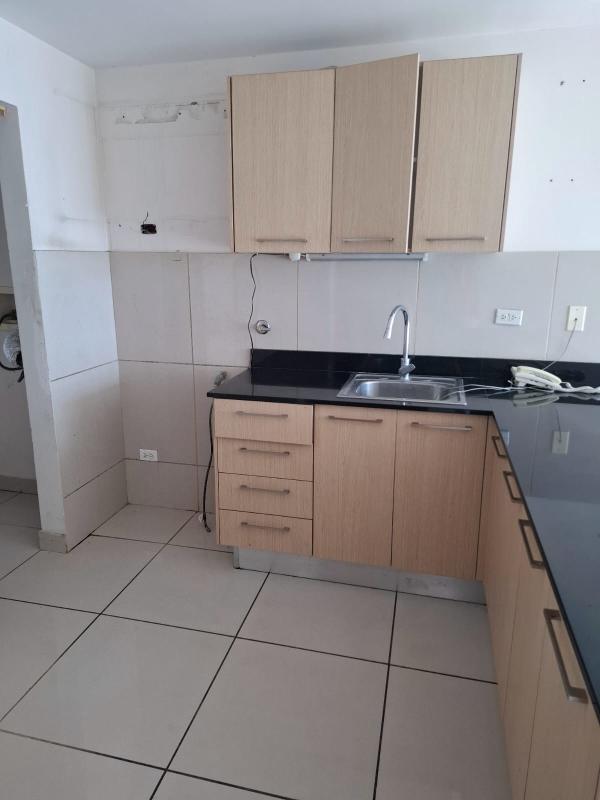 Contemporary lobby with sectional sofa, red chair, art PH Torre de Castilla Via España Panama