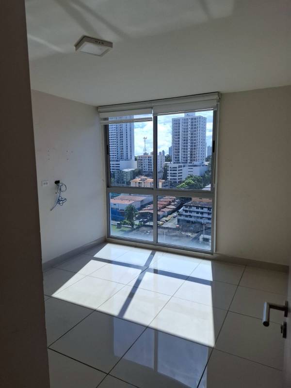 Kitchen with granite countertops, tile floor, wood cabinetry PH Torre de Castilla Panama