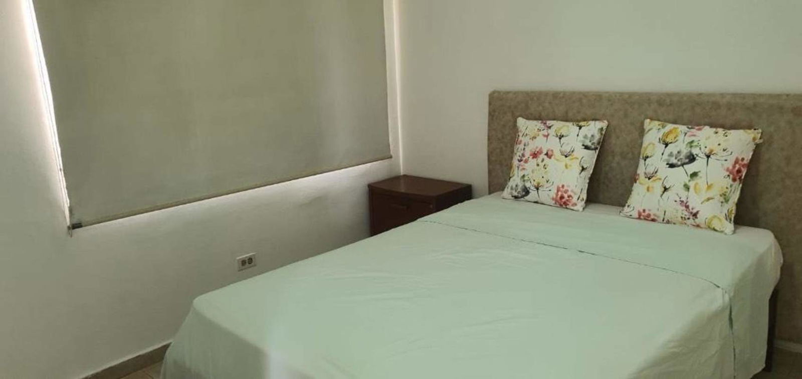 Bright living dining room with ceramic tiles furniture and balcony view PH Forest View Panama