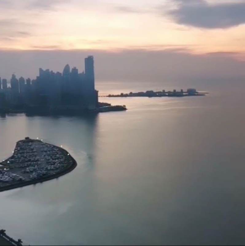 Modern heated indoor lap pool with city view glass wall PH Rivage condo tower Panama