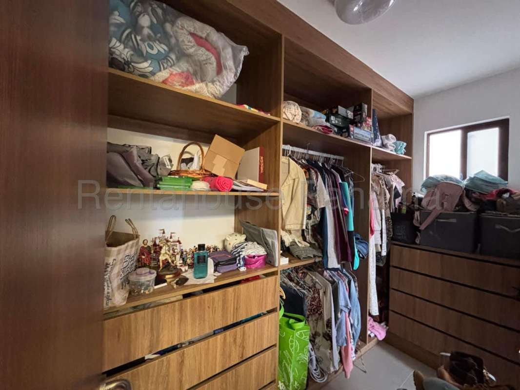 Hallway with view into bedroom inside Brisas del Golf home Panama City