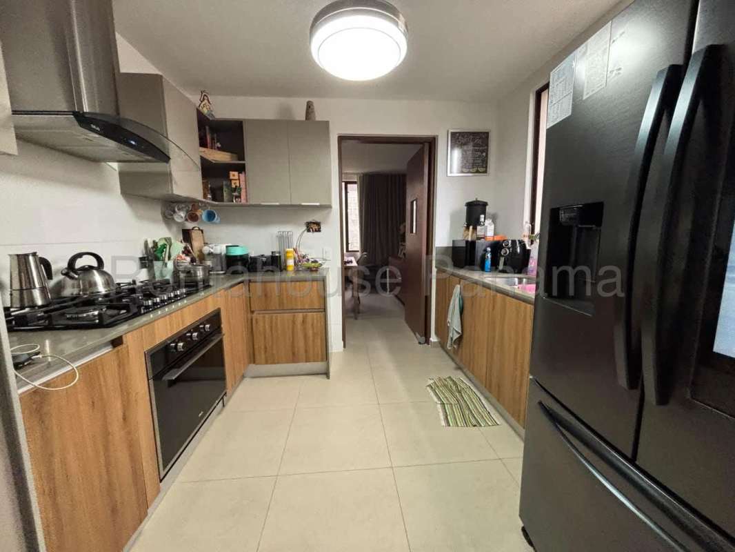 Dining room with pendant light and wood furniture in Brisas del Golf rental house