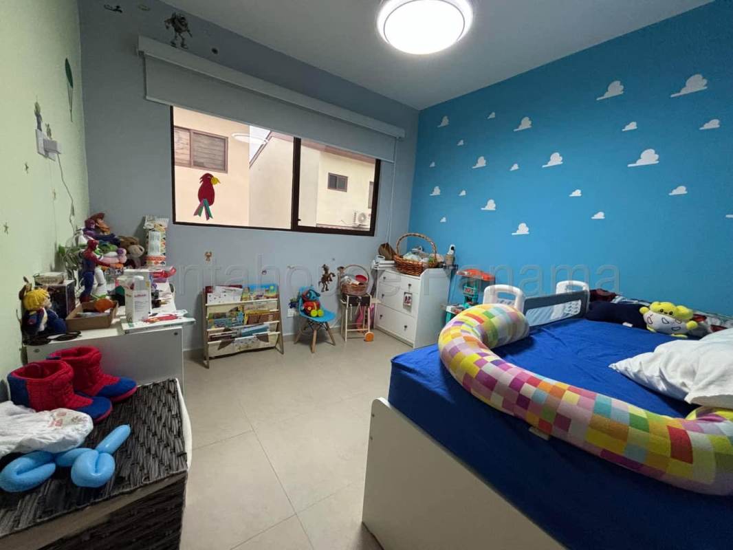 Kitchen space with modern cabinets and refrigerator in Brisas del Golf house Panama