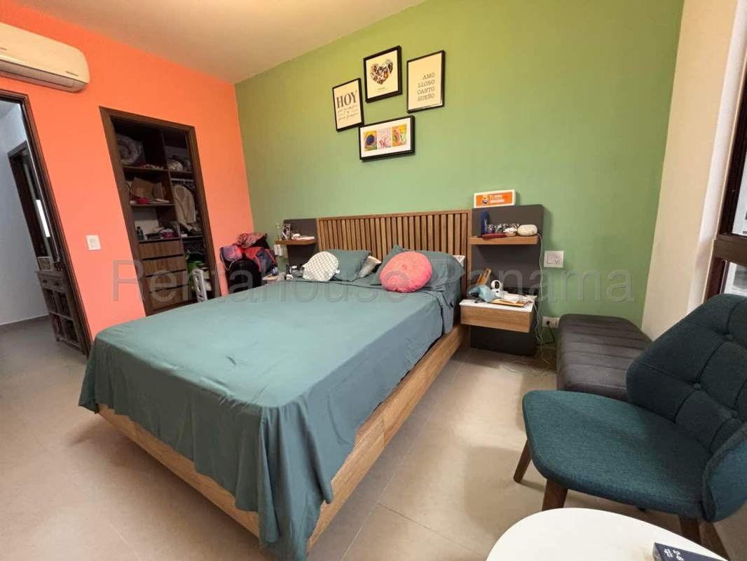 Large bedroom with closet and green accent decor in Brisas del Golf house