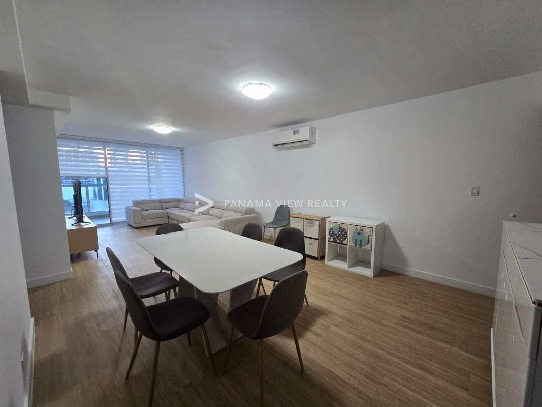 Large open plan living and dining room, marble floors, with access to balcony PH River Park Panama