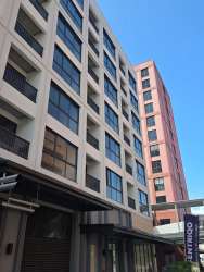 Bright living area with sliding glass door to balcony in PH Centriqo Panama Pacifico.