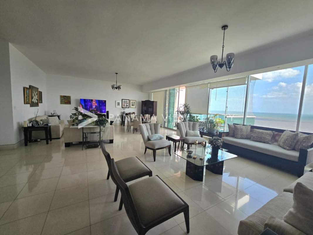 Spacious living room with ocean view and floor-to-ceiling windows at PH Ocean One Costa del Este Panama