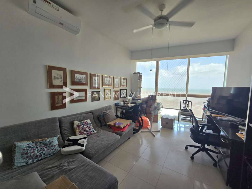 Master bedroom with ocean view, large windows, minimalist decor PH Ocean One Costa del Este Panama