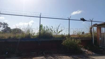 Fenced empty residential lot with clear sky in La Chorrera Panama Oeste