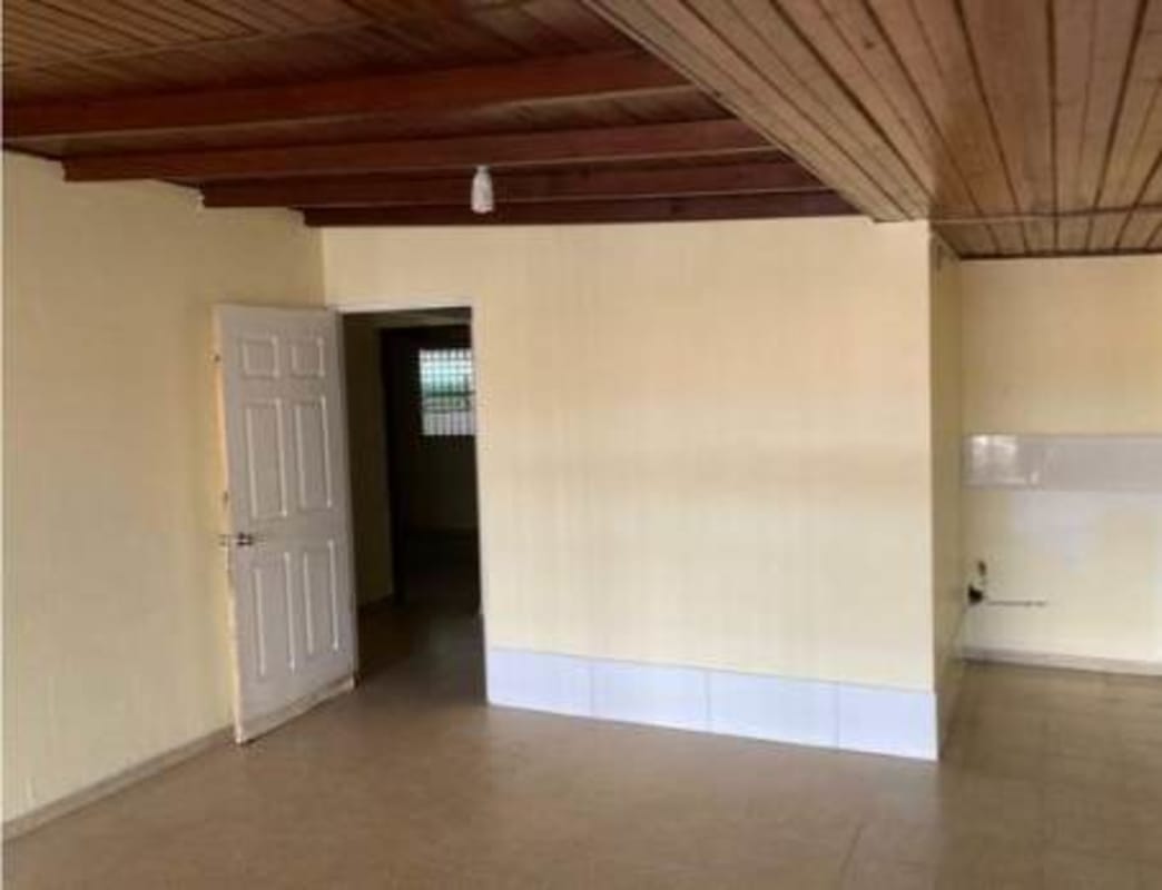 Kitchen with ceramic backsplash, open counter, wood beam ceiling in Colinas de Dorasol Panama