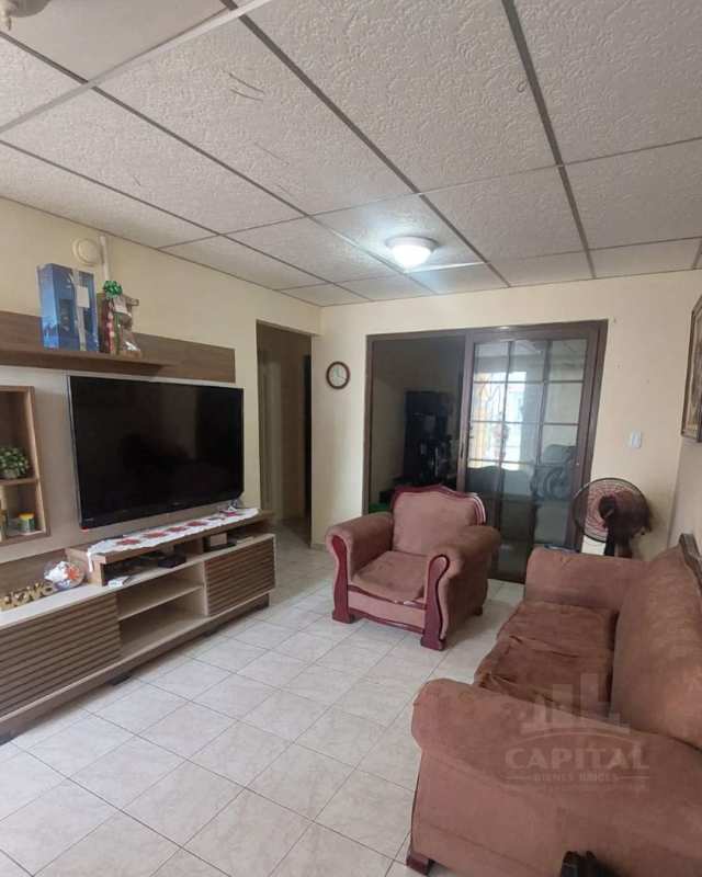 Compact kitchen with basic cabinets and tile floor in affordable Villa Don Bosco house Panama