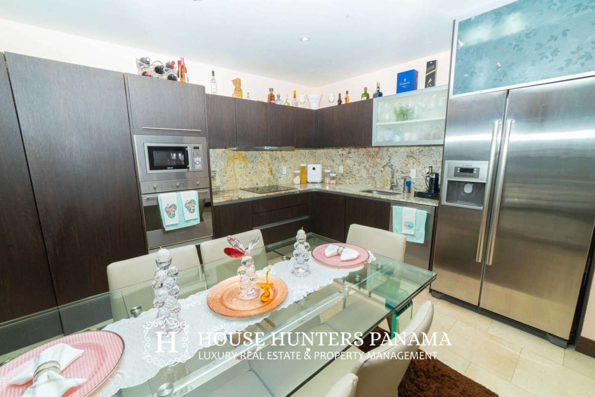 Luxury bathroom with double sinks, marble countertops and walk-in shower in The Ocean Club Panama