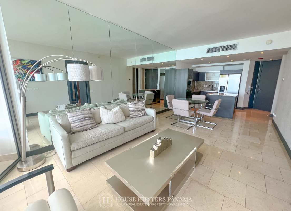 Modern open living dining area with ocean view balcony in The Ocean Club Panama City