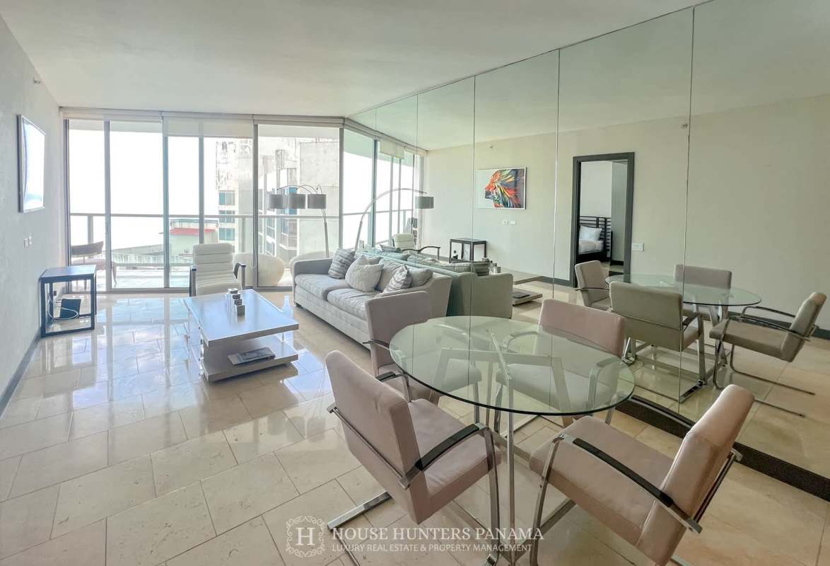 Primary bedroom with ocean view balcony floor-to-ceiling windows at The Ocean Club