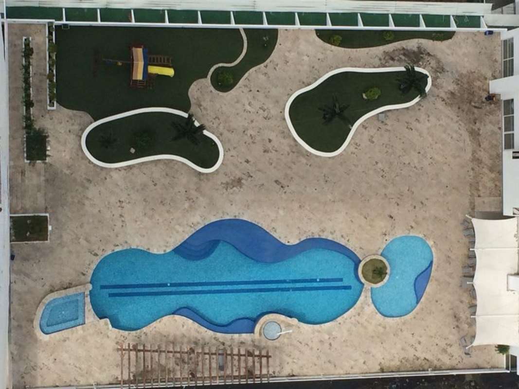 Spacious dining and living area with floor-to-ceiling windows penthouse Coco del Mar Panama