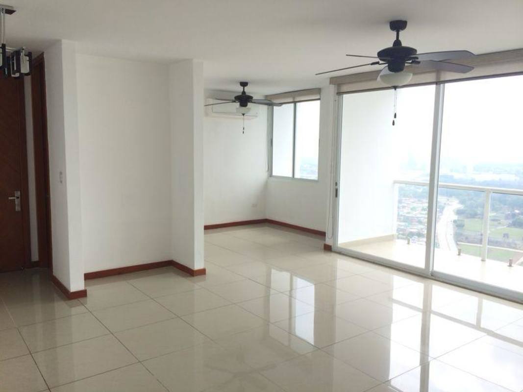 Kitchen with granite countertops and wood cabinets in penthouse PH Coco del Mar Panama City
