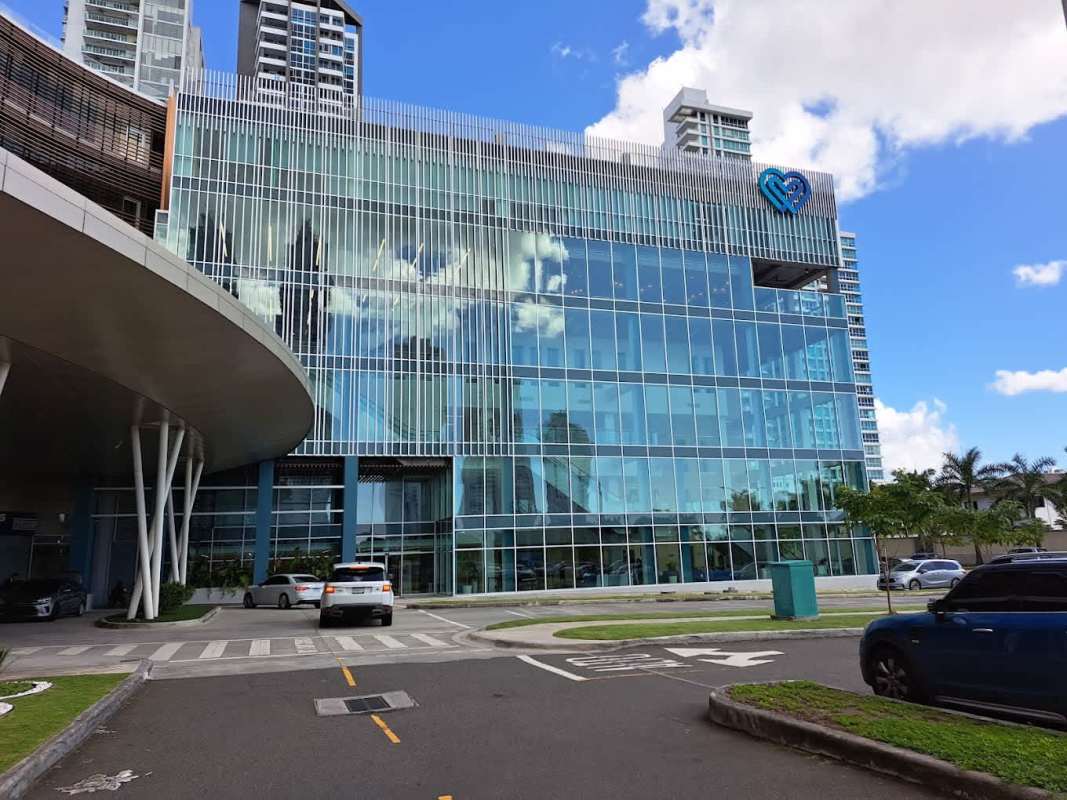 Building hallway with frosted glass and wood panels in Torre Arboleda Panama City