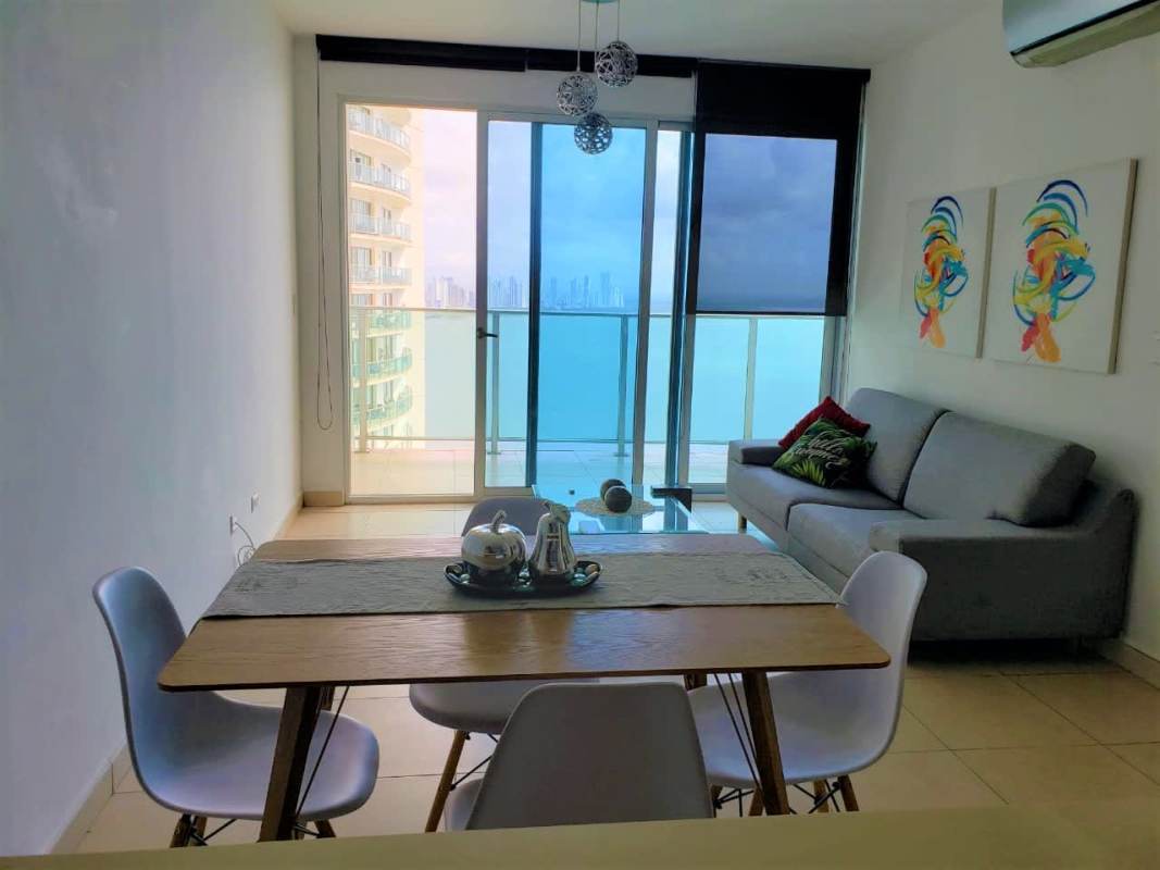 Bright furnished living dining area with ocean view balcony in PH Oasis Punta Pacifica Panama