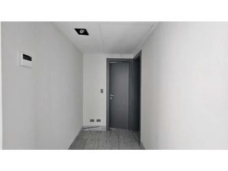 Bedroom with large window and built-in closet overlooking city skyline PH Nuovo Armani Panama