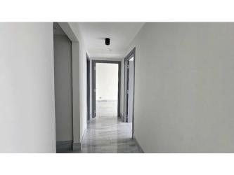 Modern kitchen with stainless refrigerator, built-in oven, marble floors PH Nuovo Armani Bella Vista Panama