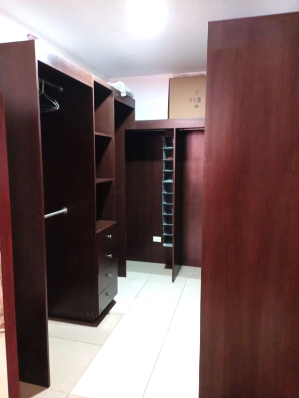 Open kitchen with granite countertops, breakfast bar and appliances PH Metric Panama City