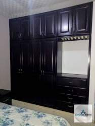 Cozy dining area with wooden table, upholstered chairs and chandelier in Panama home