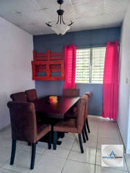 Patio with tiled flooring overlooking fenced yard and garden at rental house in Santa Rosa
