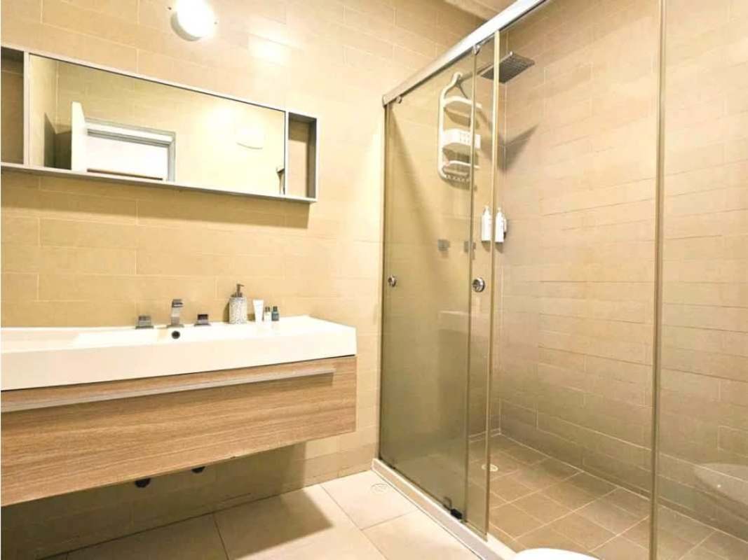 Contemporary bathroom glass shower vanity tile Waters on the Bay Panama City