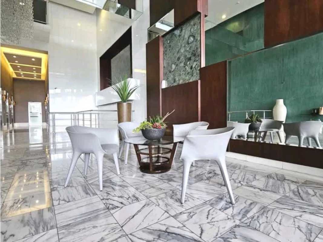 Luxurious marble lobby with seating at Waters On The Bay Panama City