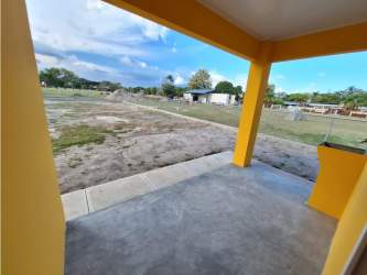 Yellow facade of new beach villa in Summer Hill Santa Clara Panama