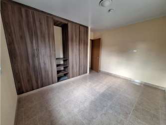 Spacious bedroom with tile floors and built-in closet in Santa Clara beach villa