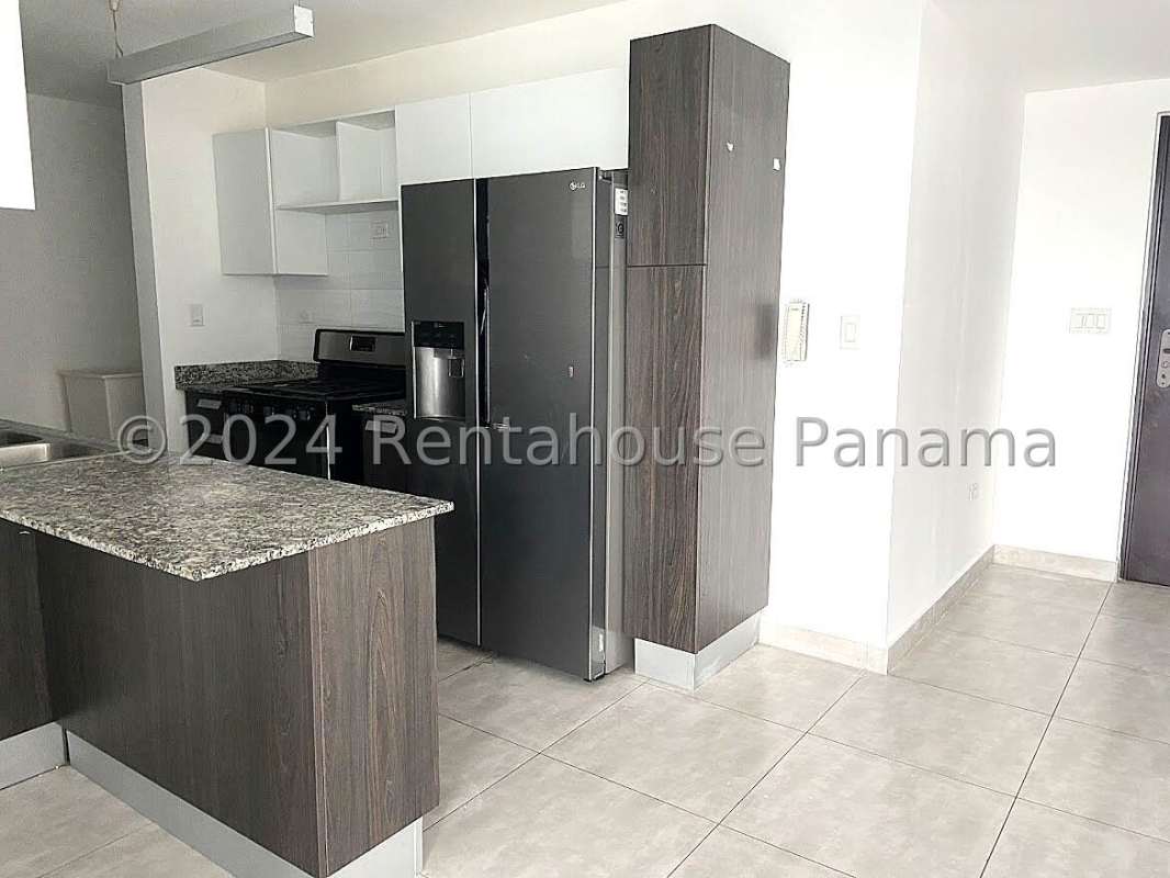 Contemporary kitchen with granite countertops and appliances in Condado Gardens Condado del Rey