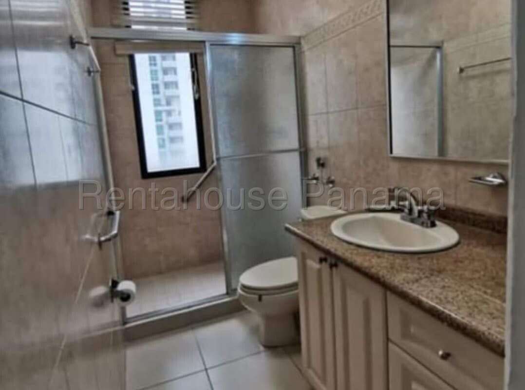 Contemporary bathroom with glass shower enclosure, granite vanity, and modern fixtures in PH Ocean View Panama