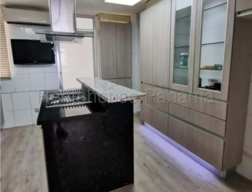 Modern living room with large window, balcony access and ocean views PH Ocean View Panama City