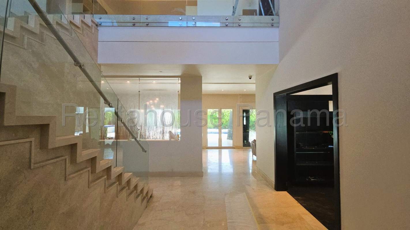 Elegant bedroom walk-in closet hardwood floors Costa del Este Panama luxury home