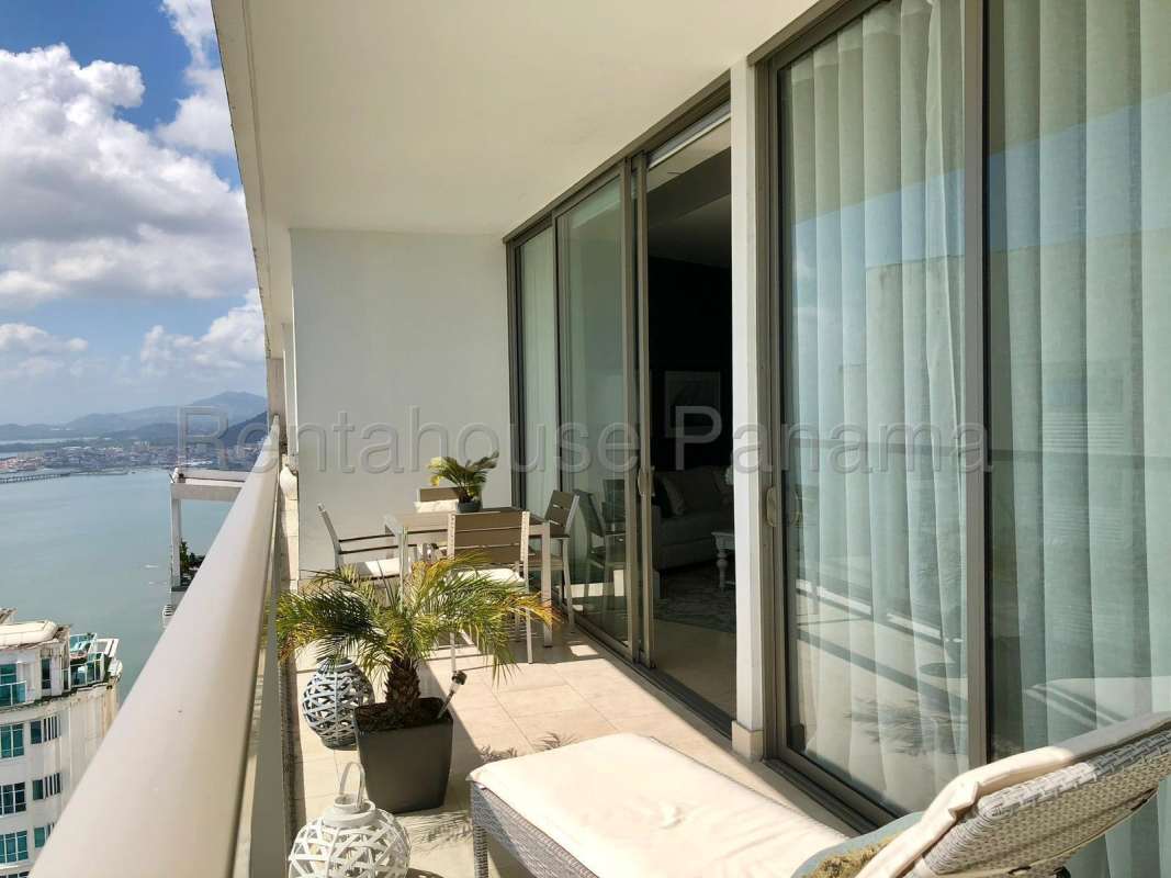 Elegant bedroom with ocean views floor-to-ceiling windows Punta Pacifica Panama