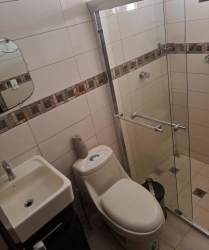 Bedroom with large dark wardrobe and tiled floor Hato Montaña Arraiján