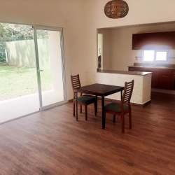 Covered terrace with tiled floor overlooking fenced backyard grass area PH Campiña Arraiján Panama