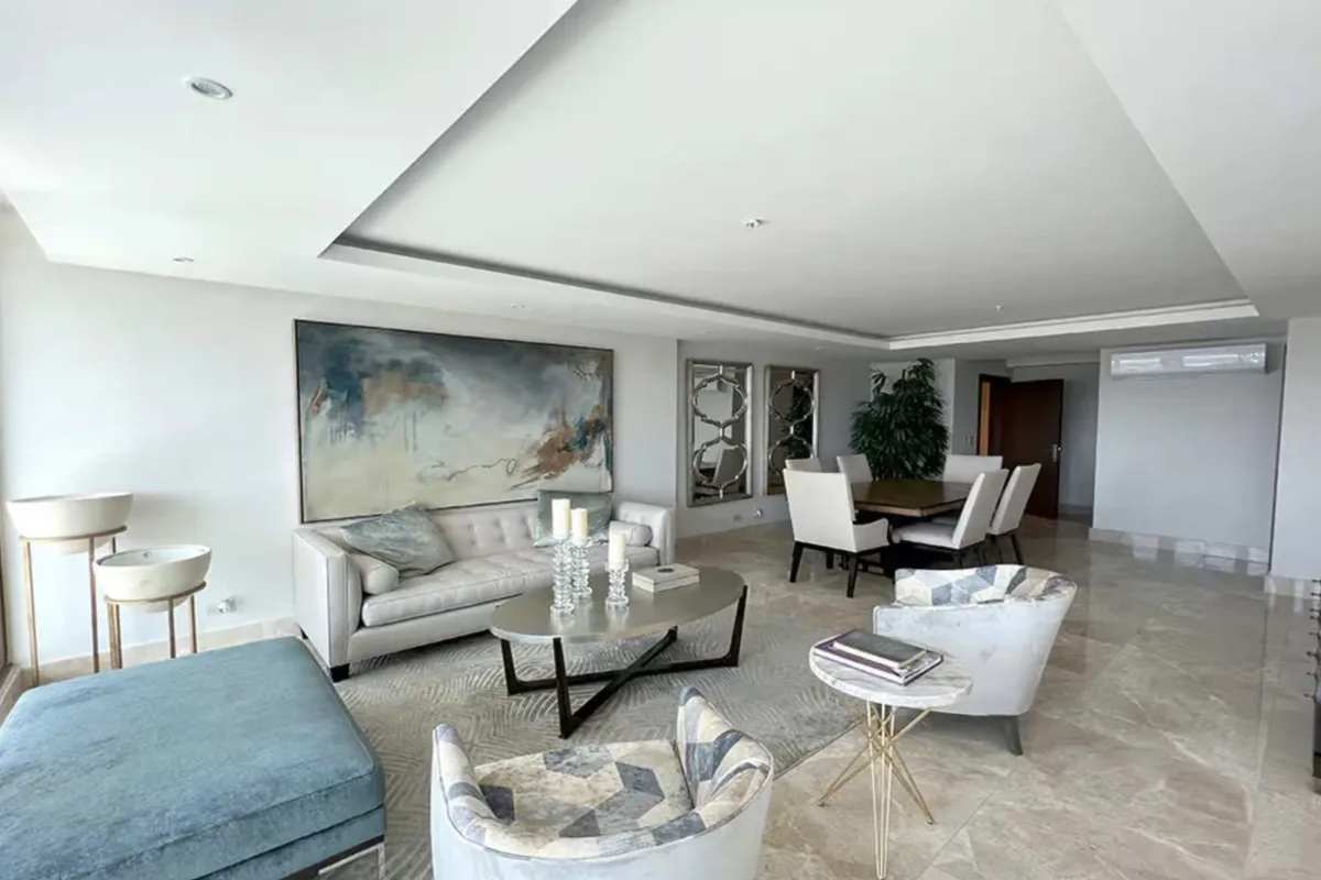 Spacious living dining room with marble floors and contemporary art in PH The Colonial Panama