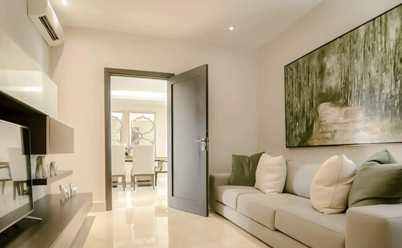 Minimalist luxury living room with split AC, large sofa, art pieces, PH The Colonial Panama