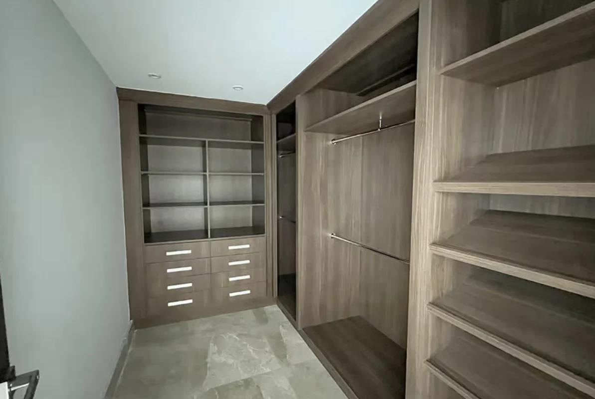 Spacious walk-in closet with built-in shelving and lighting at PH The Colonial Panama